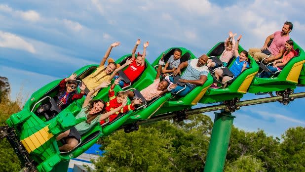 People riding a dragon rollercoaster at Legoland