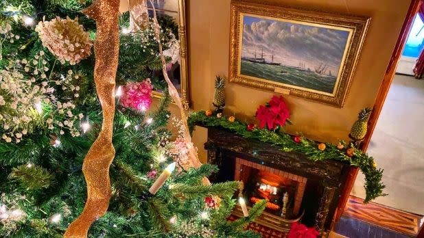 A Christmas tree and fireplace in the Seward House Museum