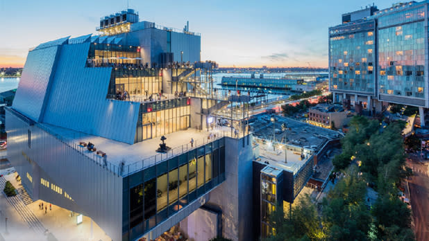 A view of the Whitney Museum at dusk