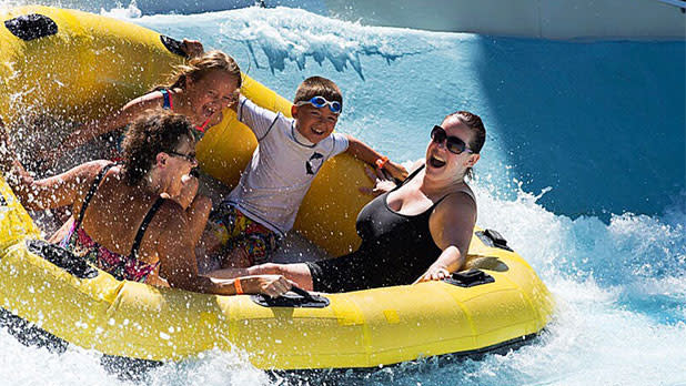 Family rides in a raft at Zoom Flume Water Park