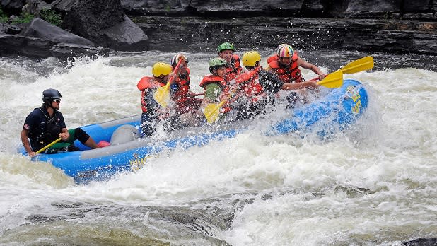 A group of people get drenched while white water rafting down the Black River in Watertown in the Thousand Islands