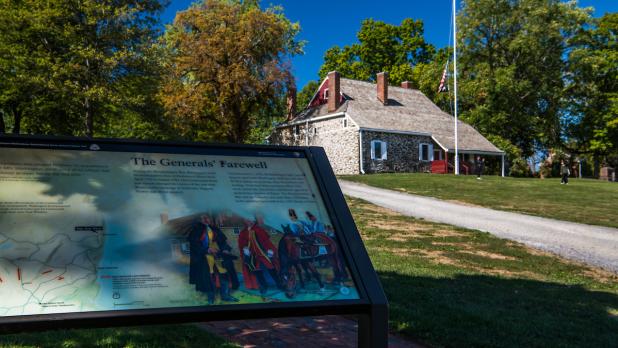 a sign that reads "The Generals' Farewell" in front of Washington's Headquarters