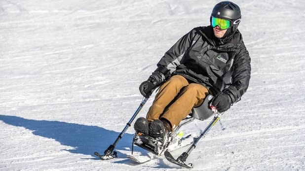 An adaptive skier in action on a snow-covered slope on Windham Mountain