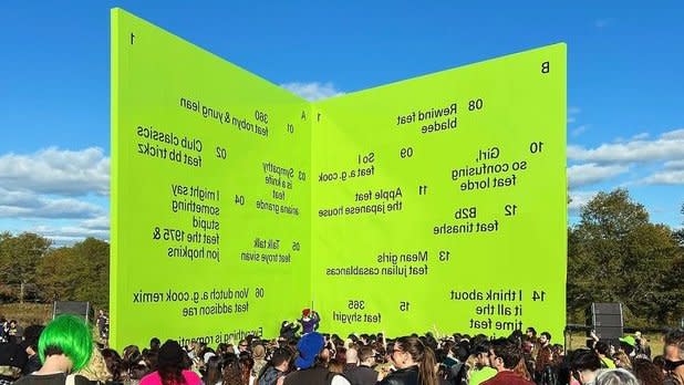 A lime green wall with the songs of Charli xcx's new brat remix album at Storm King