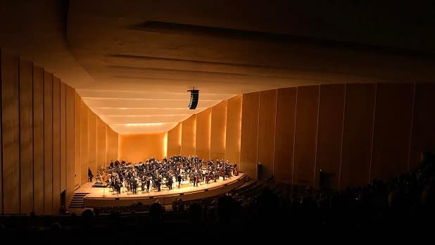 An orchestra on stage at Kleinhans Music Hall