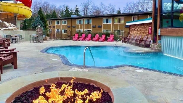 View of the pool and waterslide from the firepit at Rocking Horse Ranch