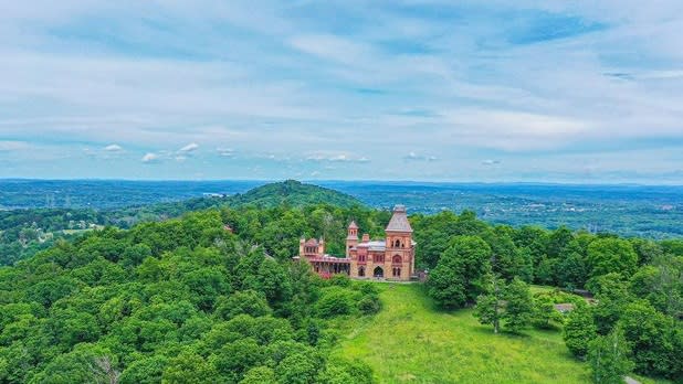 Aerial view of the Olana State Historic site surrounded by the lush green forest