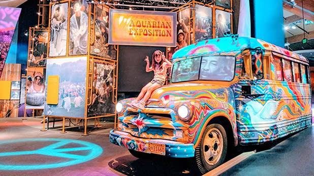 A sixties counterculture themed van and posters on display at the museum at Bethel Woods Center for the Arts