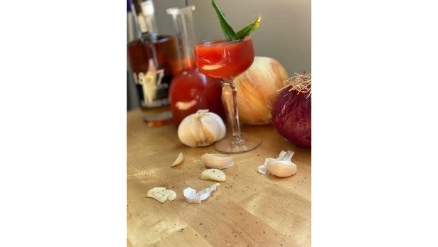 A Bloody Mary cocktail and its ingredients