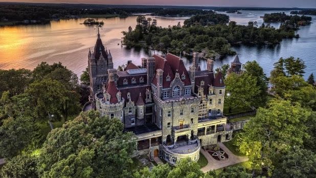 An aerial view of Boldt Castle and the river at sunset
