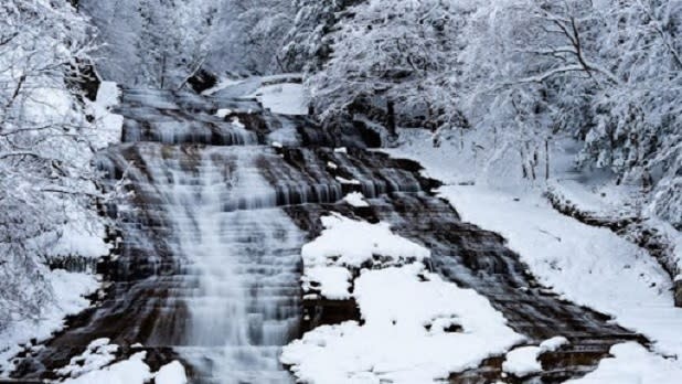 Buttermilk Falls surrounded by snow and ice
