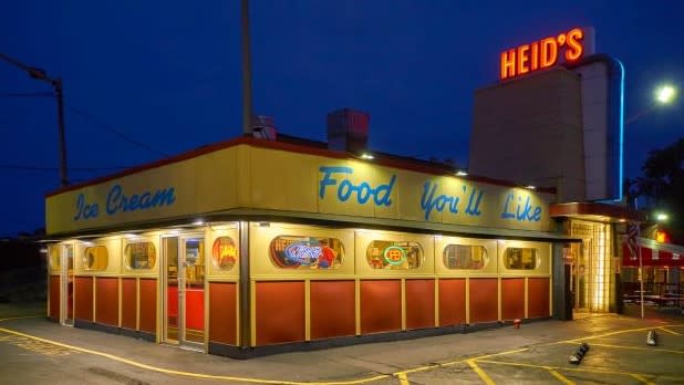 Exterior of Heid's of Liverpool, a retro-style drive-in with neon lights, at night
