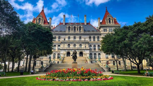 Capitol building surrounded by blooming flowers