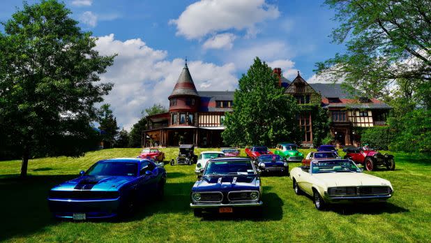 Car show on display against Sonnenburg Gardens and Mansion