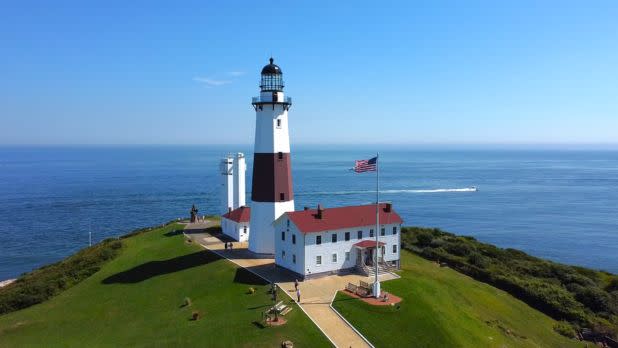 aerial view of lighthouse overlooking ocean