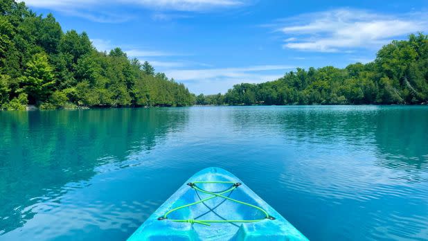 Blue kayak on blue-green waters of Green Lakes State Park