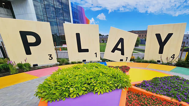 Giant Scrabble tiles spell out the word "play" at the new Hasbro Game Park at the Strong National Museum of Play