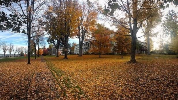 The Athenaeum Hotel at the Chautauqua Institution surrounded by fall foliage