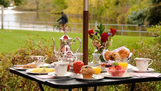 A breakfast spread on the outdoor patio at the Clarkson Inn