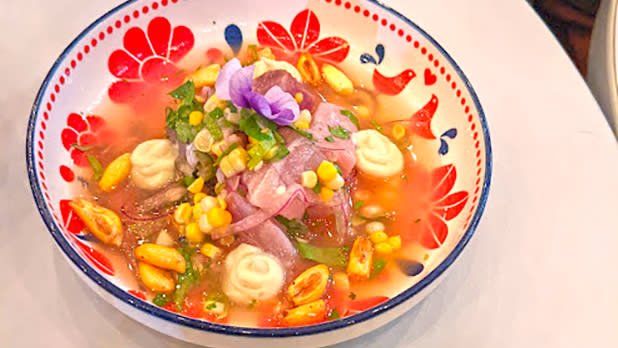 A bowl of soup and vegetables at Contento restaurant