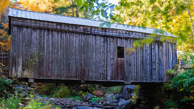 The 35-foot long Copeland Covered Bridge crosses over Beecher's Creek amid colorful fall foliage