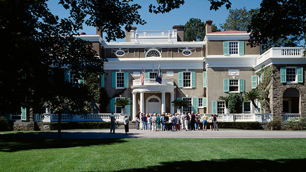 Exterior of the Franklin D. Roosevelt Home and Presidential Library with a group of people gathered in front of it