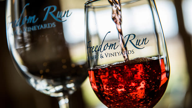 Wine being poured into glasses at Freedom Run Winery in Lockport, NY.