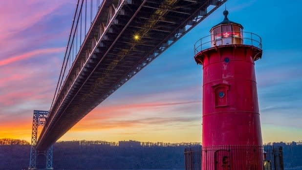 The Little Red Lighthouse under the George Washington Bridge at sunset