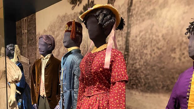 Mannequin's dressed in historical clothing on display