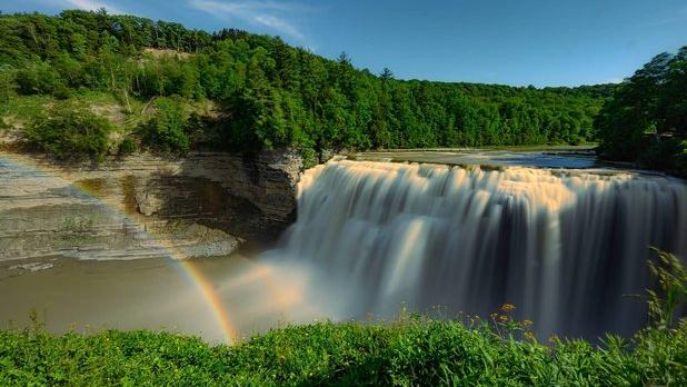 A rainbow stretching across the falls at Letchworth State Park