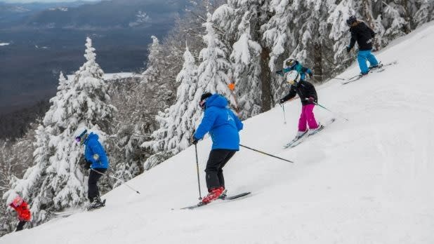 Five people skiing down Gore Mountain