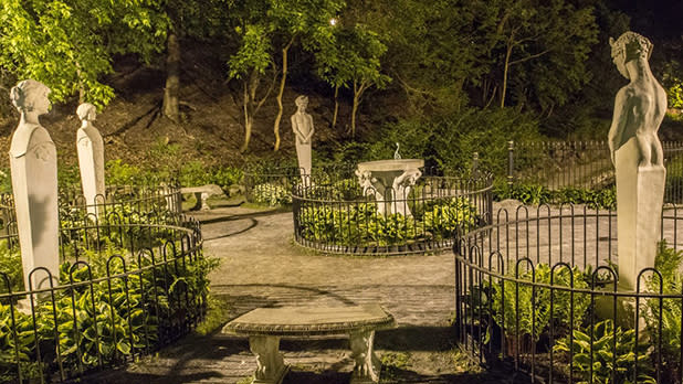 Creepy statues seen at nighttime on a haunted tour of Saratoga Springs