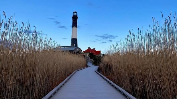 Greay boardwalk leading up to the Fire Island Lighthouse