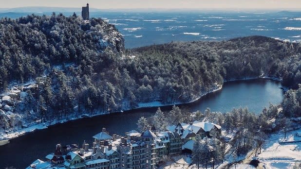 Aerial view of Mohonk Mountain House covered in snow