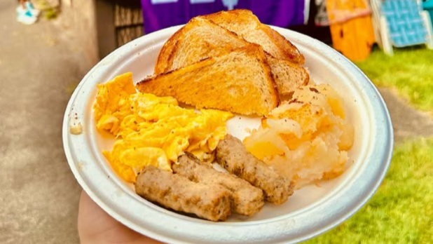 A breakfast platter of toast, home fries, scrambled eggs, and sausage from the Soup House in the Indian Village at the New York State Fair.