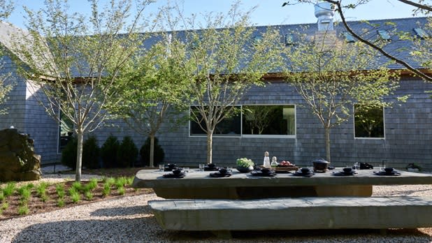 An outdoor table for dining at Shou Sugi Ban House