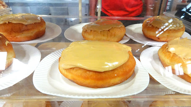 Maple-glazed doughnuts in a display case at the Great New York State Fair.