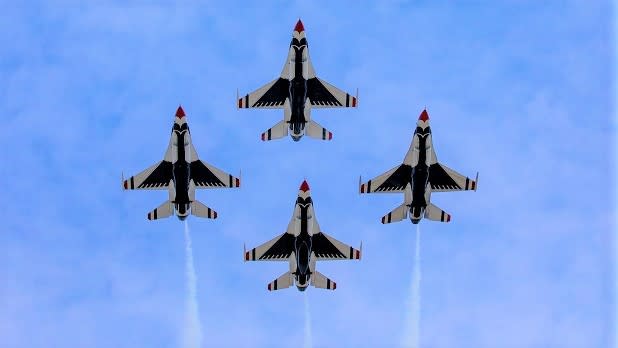 The red, white, and blue underbellies of the US Air Force Thunderbirds flying overhead at the Bethpage Air Show at Jones Beach