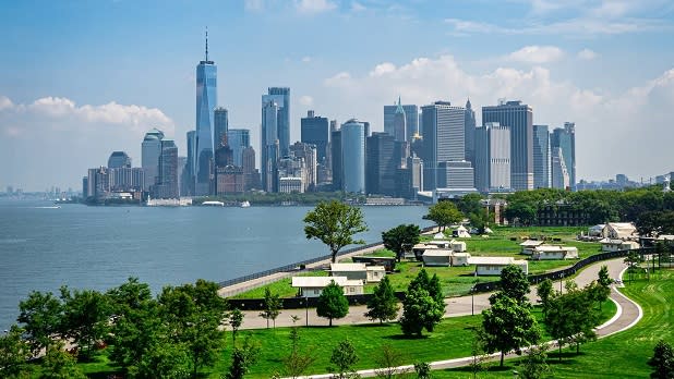 View of Manhattan from the green landscape of Governors Island