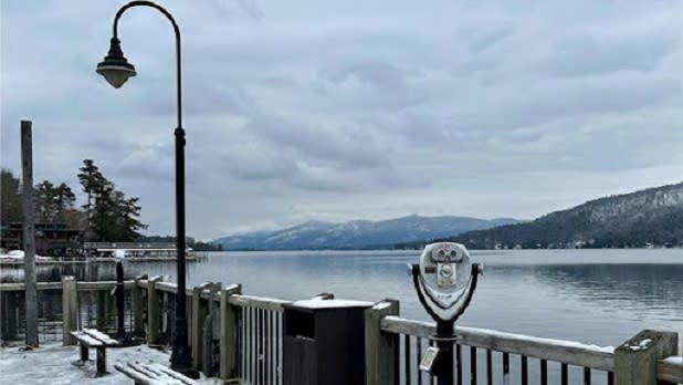 View from Lake George public dock looking out at the lake and snow covered mountain