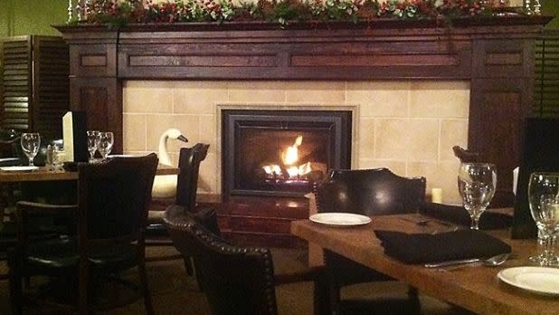 A fireplace in the dining room at Landmark