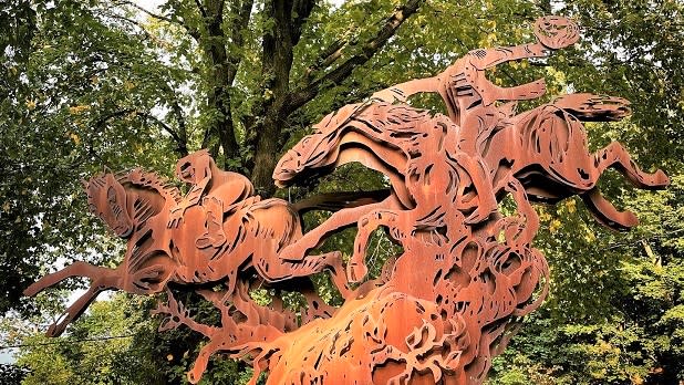 An 18-foot steel sculpture depicting the Headless Horseman chasing Ichabod Crane stands in Sleepy Hollow