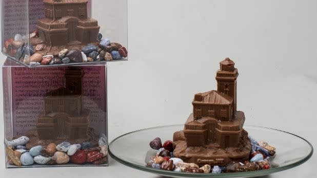 Gift boxes and a plate featuring the Oswego Lighthouse in chocolate