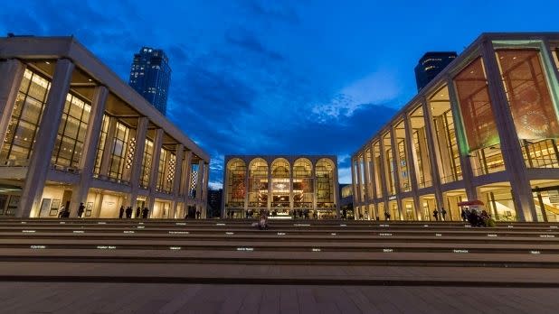 A view of three Lincoln Center buildings at night