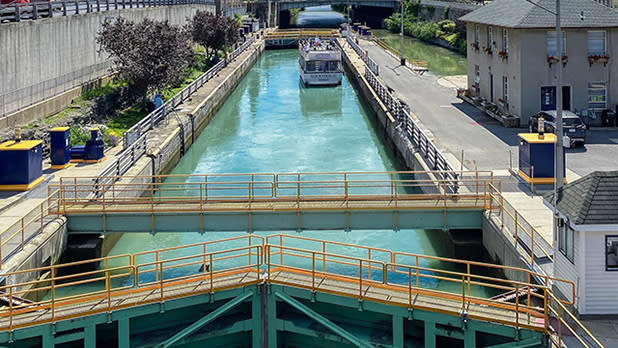 A boat navigates its way through the Erie Canal in Lockport