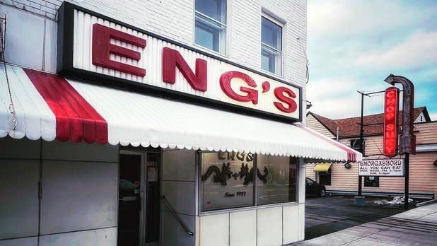 Exterior of Eng's Chinese Restaurant in Kingston, NY in the Hudson Valley. "Eng's" is written in large red letters above the white storefront.