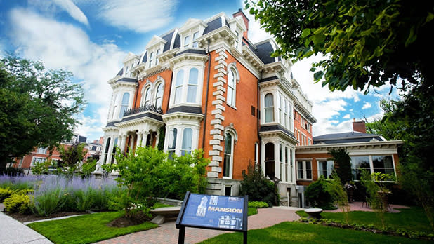 Brown brick mansion and hotel trimmed in white in Buffalo.