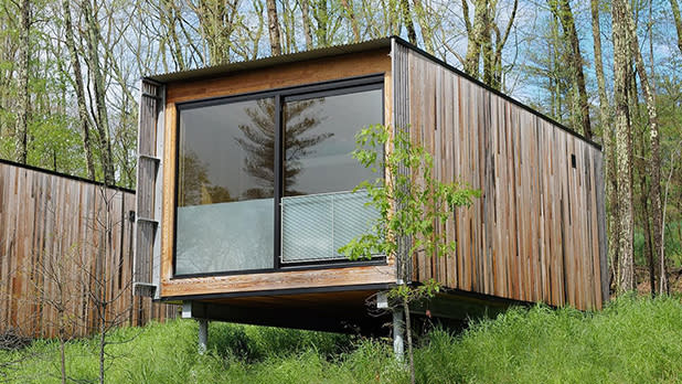 A chic forest cabin hovers above a hill at Piaule Catskill
