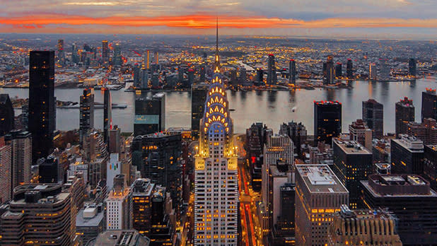 The Chrysler Building in Manhattan, the East River and Queens during sunrise viewed from The Summit at One Vanderbilt.