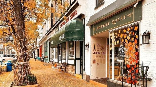 POV from main street in Clinton, NY covered in orange fall leaves